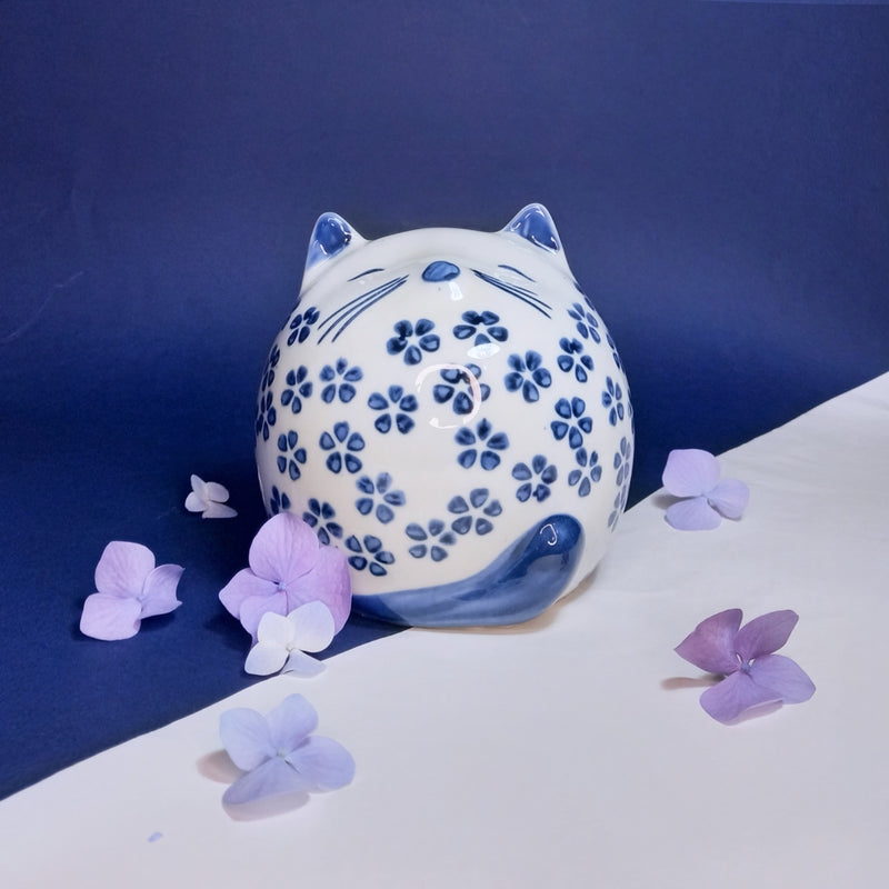 Round Cat ornament with blue daisy pattern